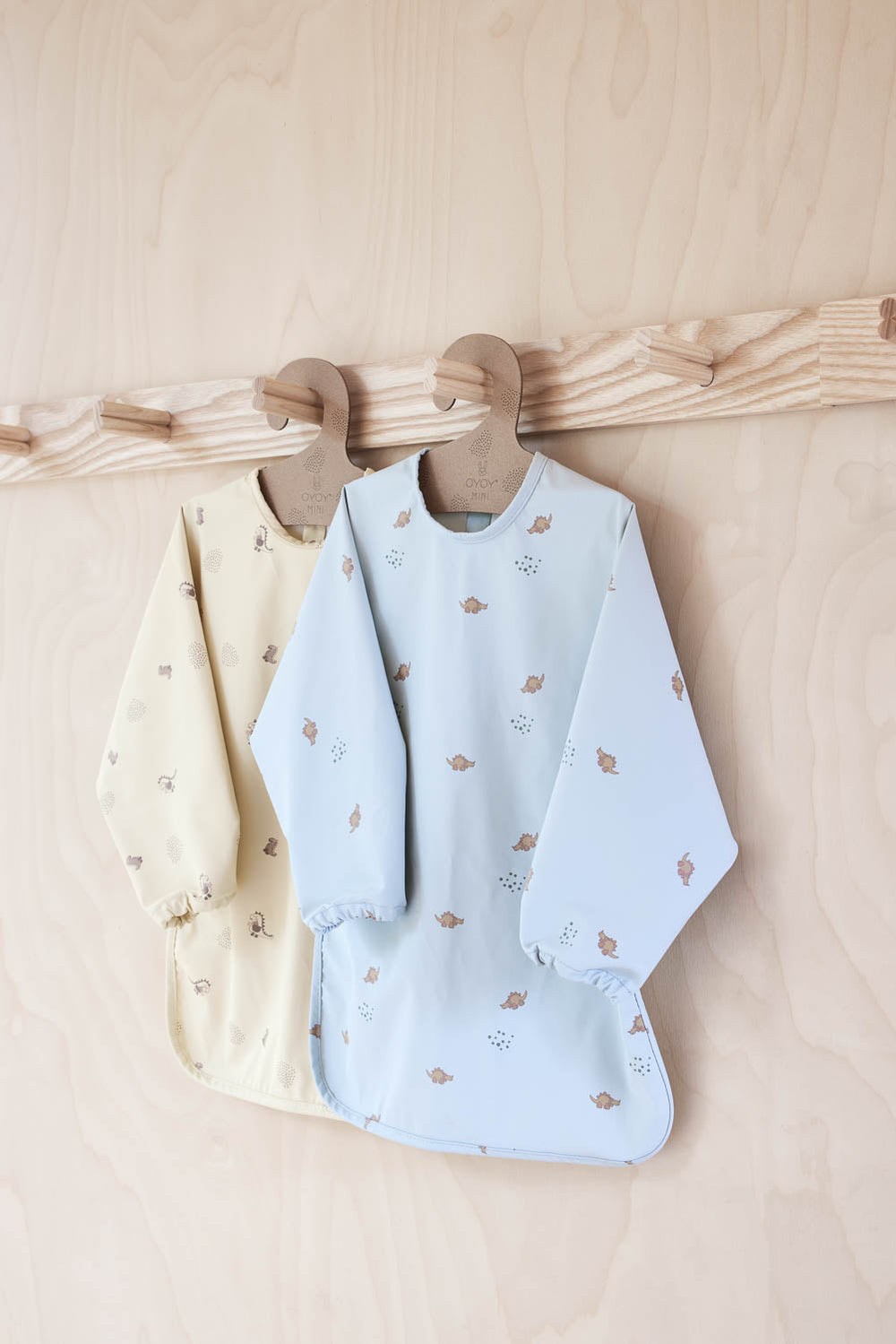 dino cape bib in dusty green 3