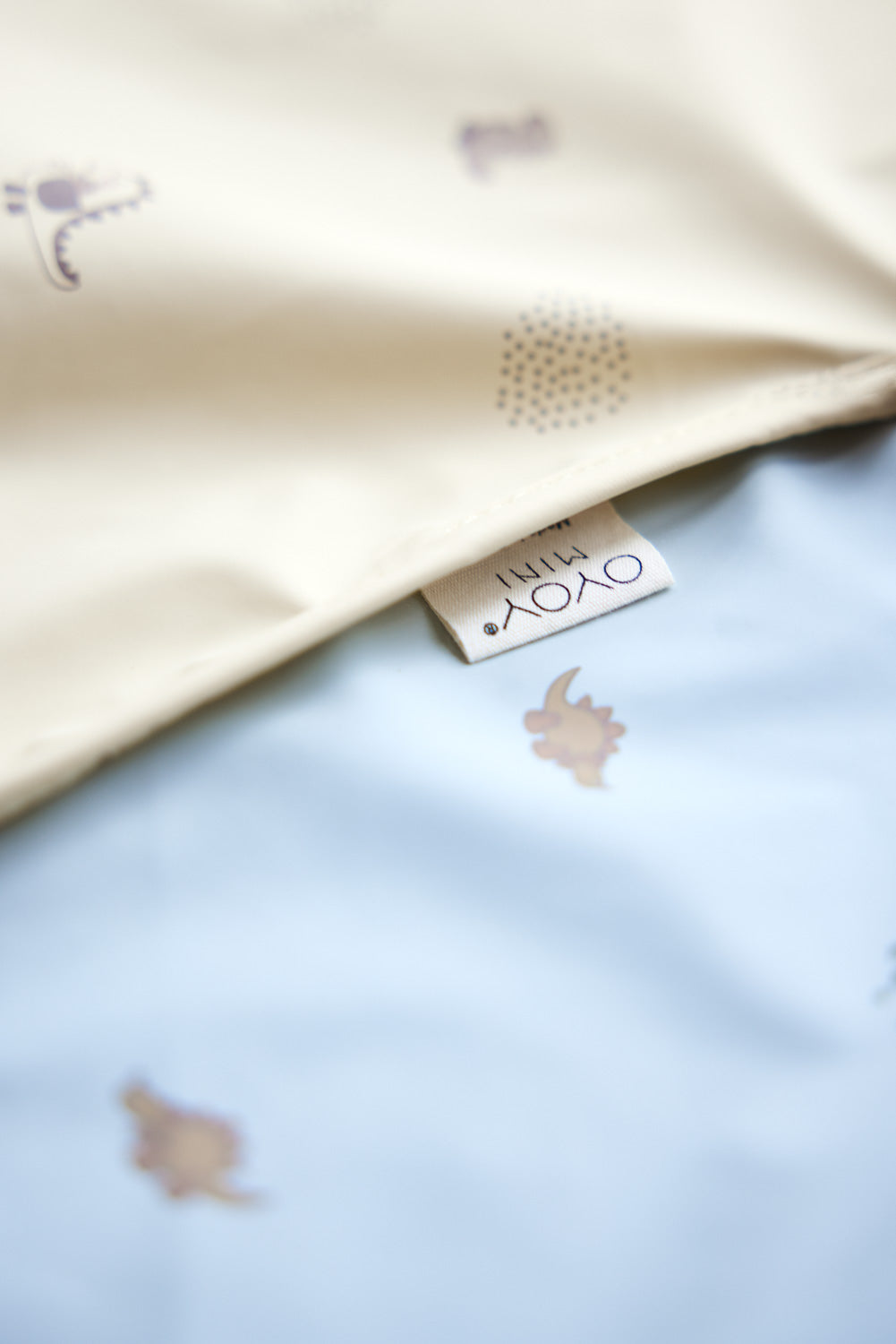 dino cape bib in dusty green 2